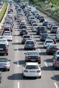 traffic jam on highway with red backlights shining